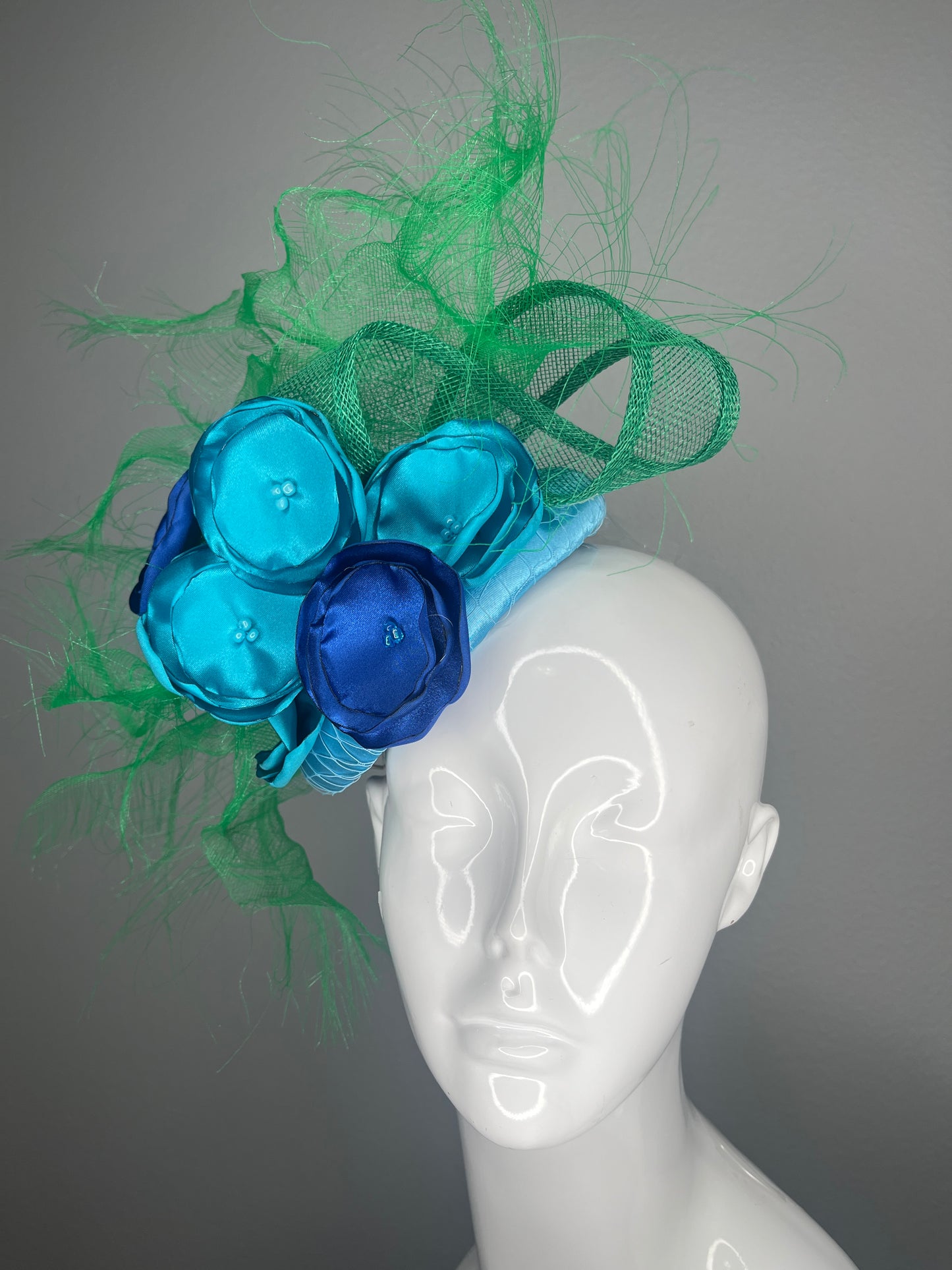 Turquoise Blue and Royal Blue Floral Fascinator with Green Sculptural Sinamay Accents