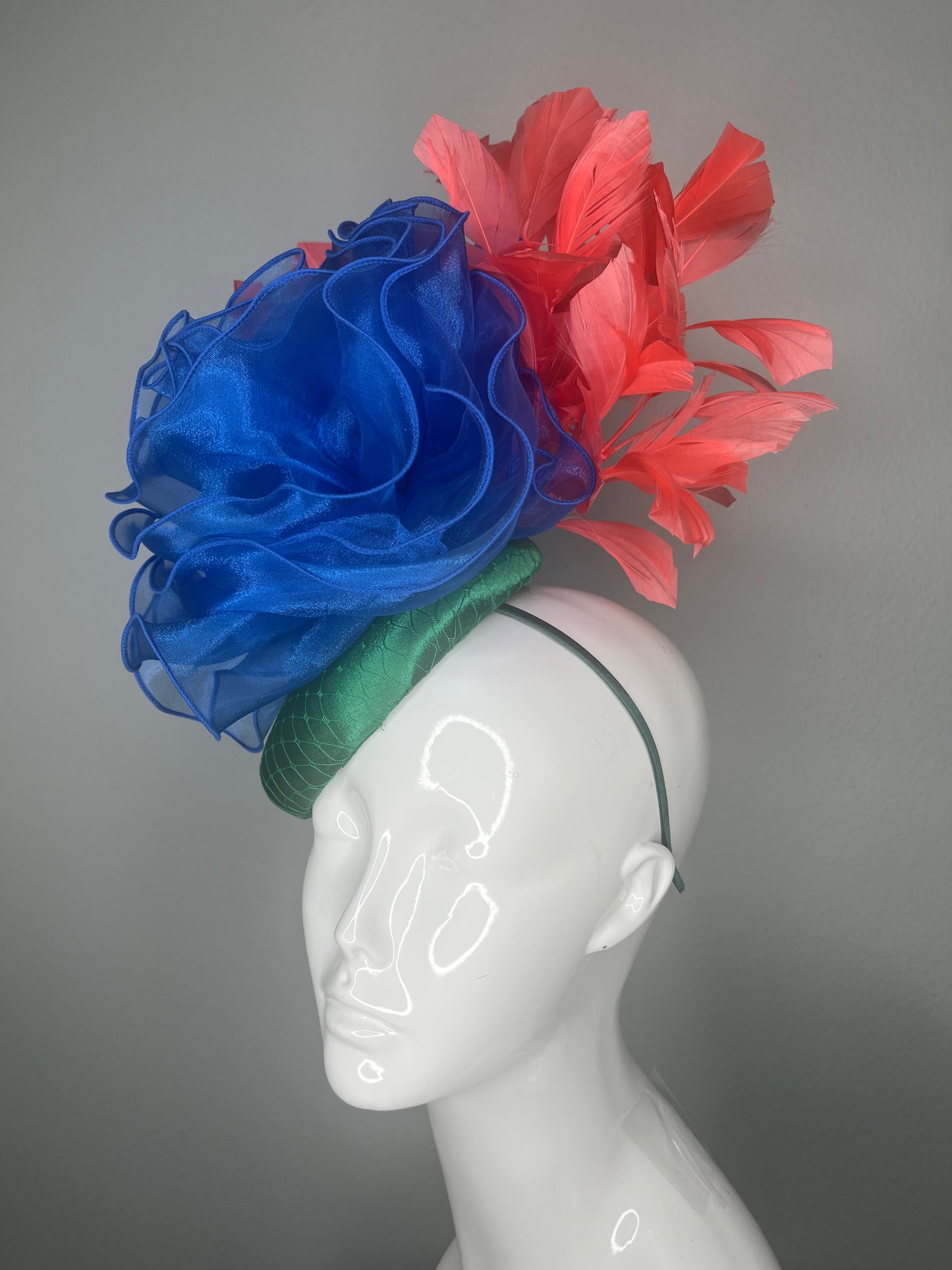 Kentucky Derby Fascinator Hat  Emerald Green Satin Base with Royal Blue Organza Flower Coral Feather Plumes