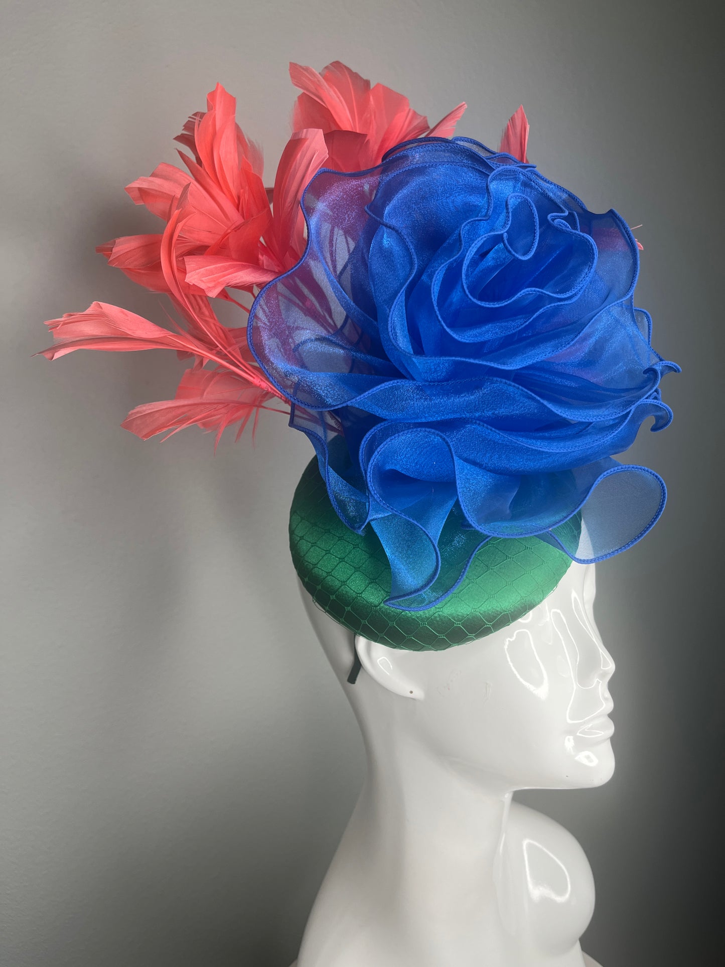 Kentucky Derby Fascinator Hat  Emerald Green Satin Base with Royal Blue Organza Flower Coral Feather Plumes