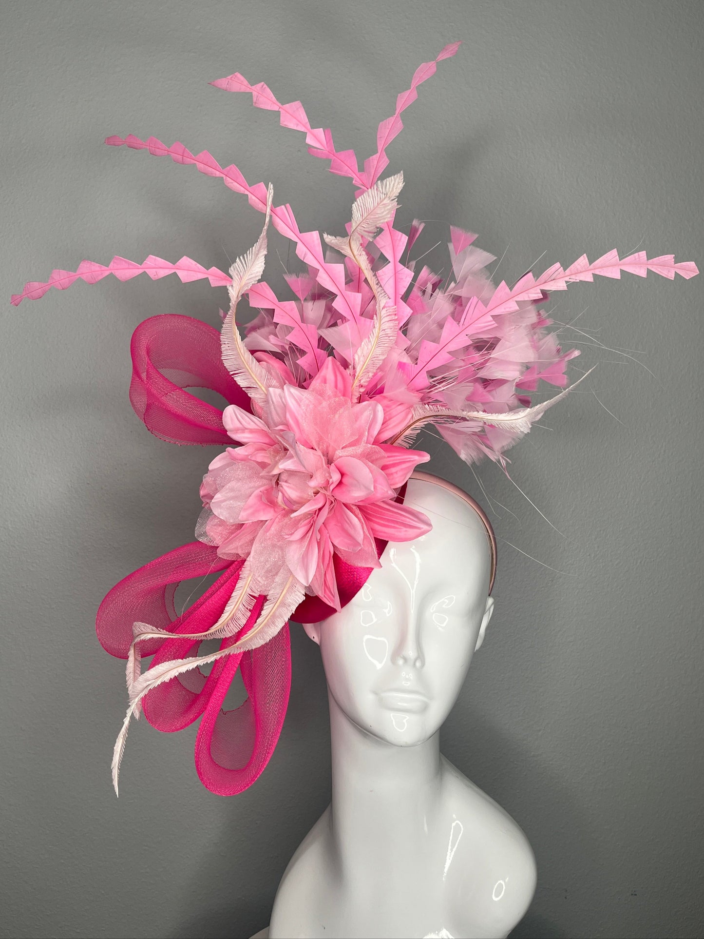 Bold Pink Statement Fascinator Hat with Floral and Feather Accents