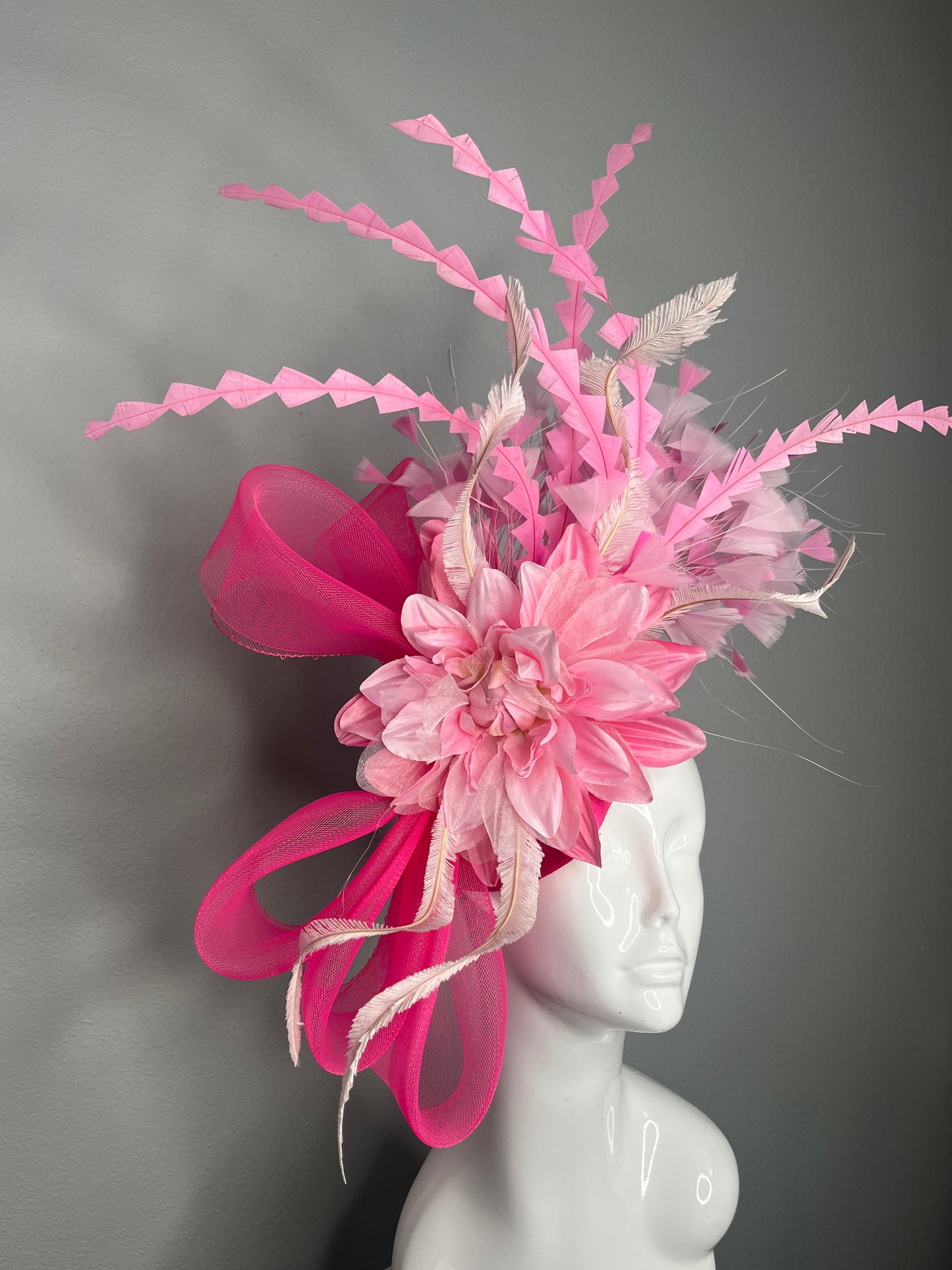 Bold Pink Statement Fascinator Hat with Floral and Feather Accents