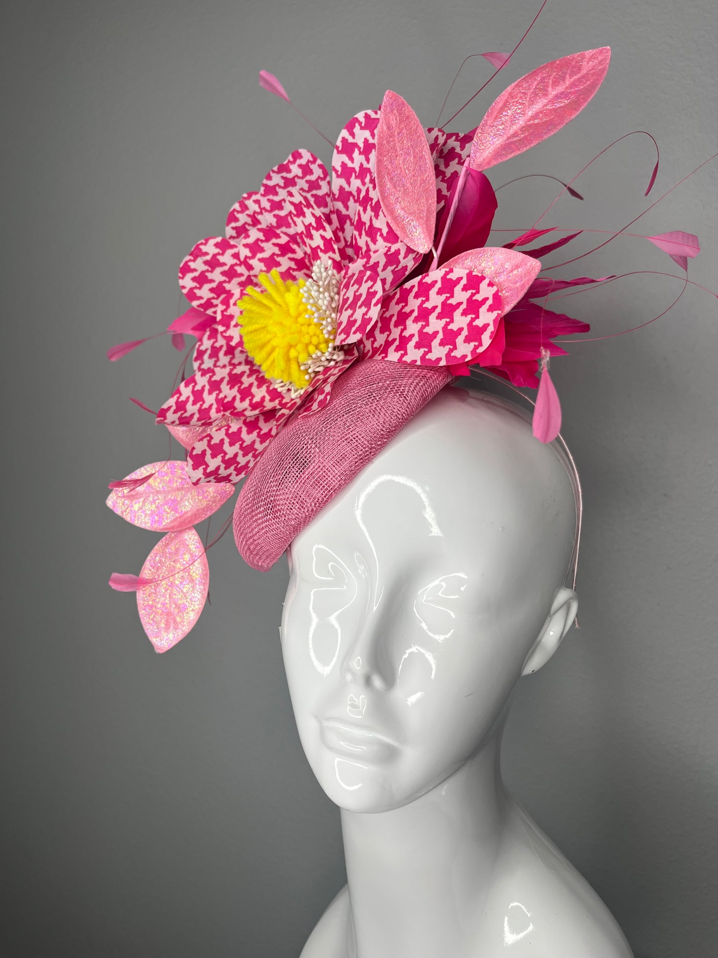 Hot Pink Fascinator with Houndstooth Flower, Yellow Center, and Iridescent Pink Leaves on a Structured Base